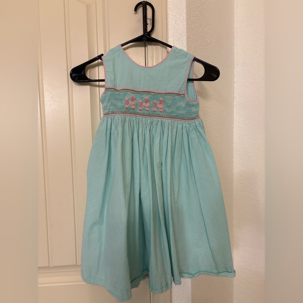 Remember Nguyen smocked dress in aqua gingham with pink poodle embroidery